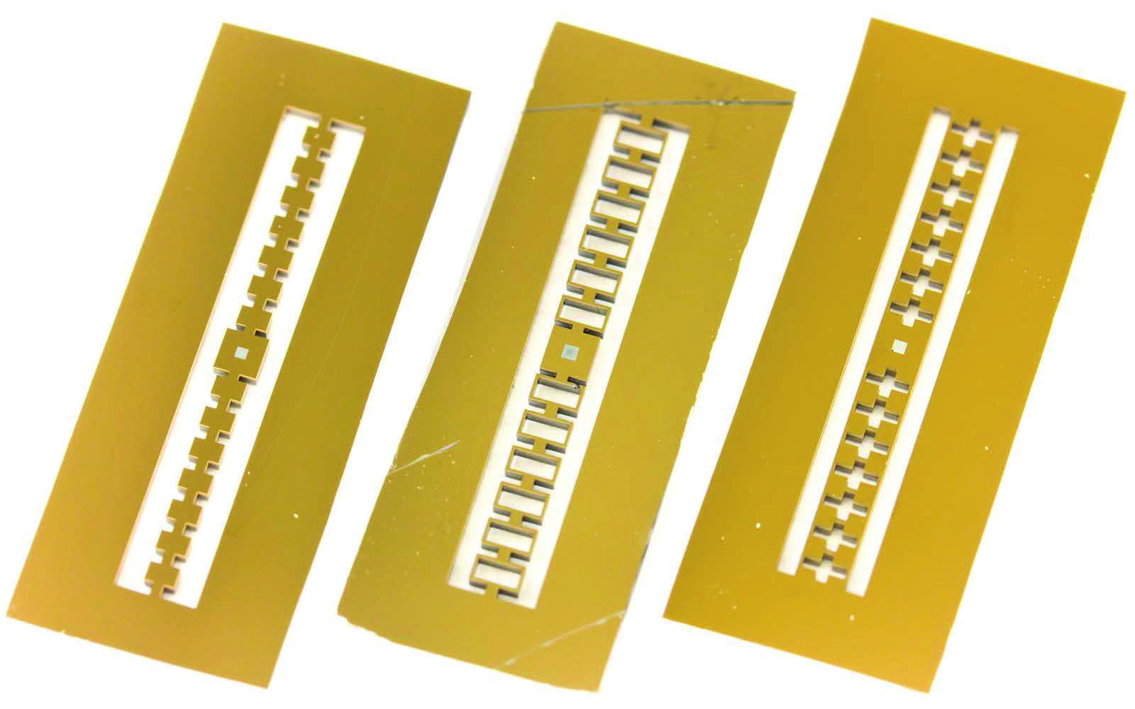 Demonstration of suppressed phonon tunneling losses in phononic bandgap shielded membrane resonators for high-Q optomechanics